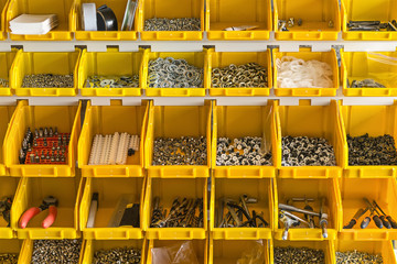 Plastic yellow boxes with instruments on wall