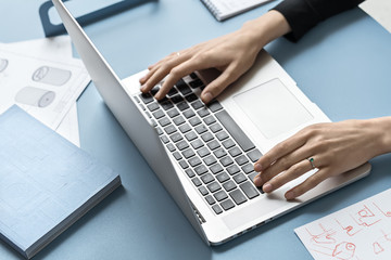 Girl using laptop in office