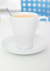 cup of coffee over white background