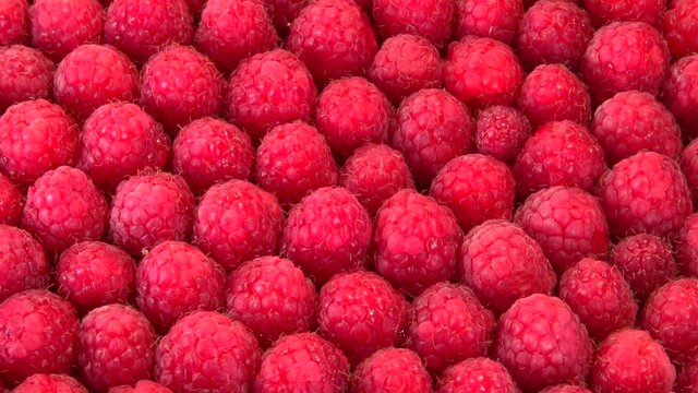Raspberry. Ripe raspberry background. Closeup berries background rotates. Raspberries is spinning 360. Looping is possible. High speed camera shot. Full HD 1080p. 