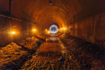 Abandoned old rusty dirty metal mining tunnel