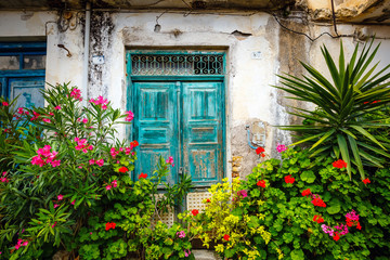 Fototapeta na wymiar Narrow street in the village of Kritsa near Agios Nikolaos, Crete, Greece