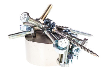 Screws and bolts on a neodymium magnet