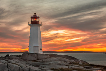 Sunset at the Lighthouse at Peggy's Cove near Halifax, Nova Scotia - obrazy, fototapety, plakaty