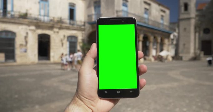 Walking POV in Havana's Plaza de la Catedral with a green screen smartphone. With optional corner pin markers for advanced tracking.  	