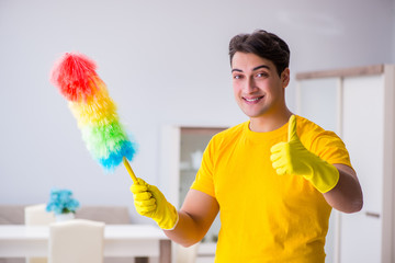 Young man doing chores at home