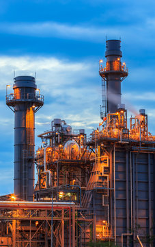 Gas turbine electrical power plant at dusk with blue sky
