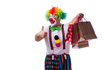 Funny clown after shopping bags isolated on white background
