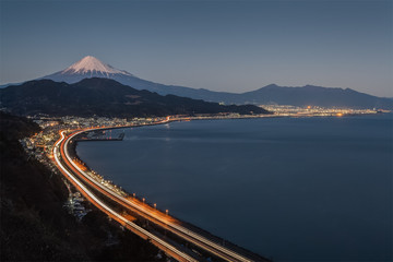 Winter Mt. Fuji with Long exposure of Tomei expressway at Suruga Bay , Shimizu Town , Shizuoka prefecture.