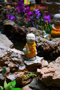 smiling monk statue