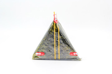 Portable Onigiri a Japanese rice ball wrapped with seaweed in sealed plastic on white background,...
