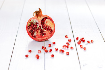 Ripe red pomegranate on a white background