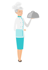 Senior caucasian chef holding towel and cloche.