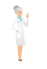 Senior caucasian doctor showing ok sign.