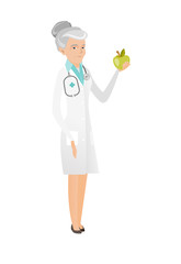 Caucasian nutritionist offering fresh red apple.
