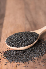 Basil seeds in spoon.