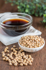 Soy bean with soy sauce on wood table.