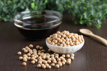 Soy bean with soy sauce on wood table.