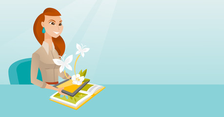 Young woman holding tablet computer above the book