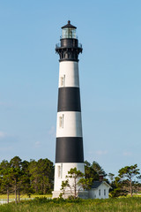 The Bodie Island lighthouse surrounded by Cedar trees on the Outer Banks of North Carolina near...