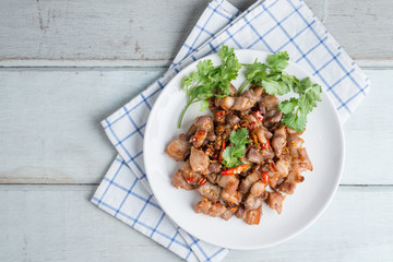 Fried pork crackling with garlic and chili.