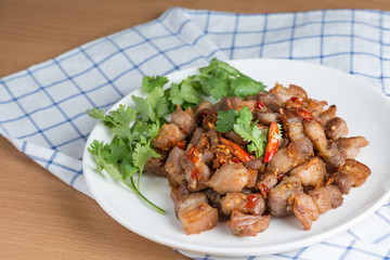Fried pork crackling with garlic and chili.