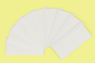 Blank white three fold brochure mockup on yellow background
