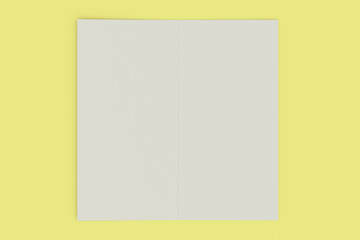 Blank white two fold brochure mockup on yellow background