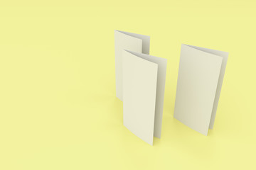 Blank white two fold brochure mockup on yellow background