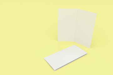 Blank white two fold brochure mockup on yellow background