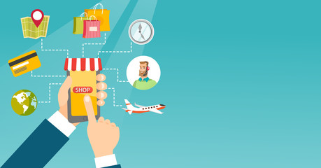 Hands holding phone connected with shopping icons.