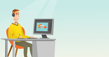 Caucasian designer using digital graphics tablet.