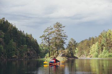 A man on a kayak against a beautiful nature