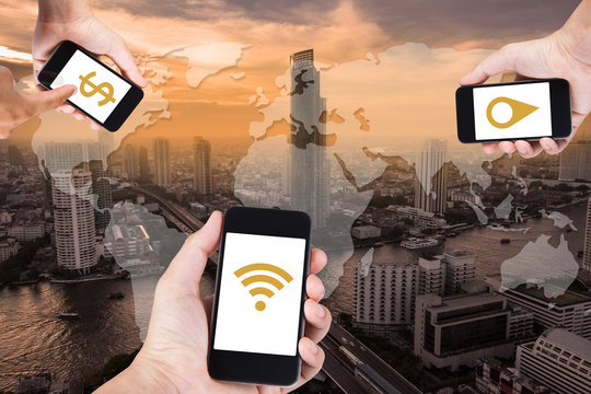 Man hand using smartphone searching data everything by wifi on top view cityscape in Bangkok, Thailand.