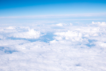 Clouds and sky sunny day through airplane window