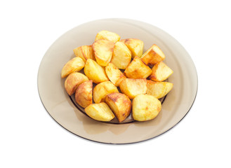 Fried potatoes on the dark glass dish