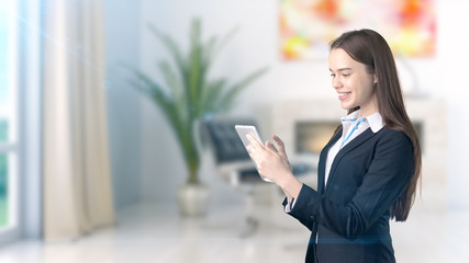 Young beautiful business woman and creative designer standing over blured interior background