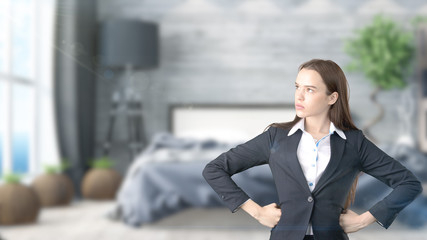 Young beautiful business woman and creative designer standing over blured interior background