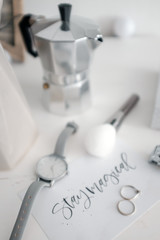 Moka pot and Women's watches  on the table