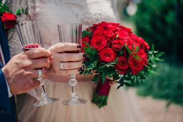 Wine glasses and bouquet of roses