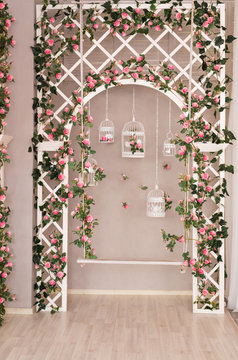 Shabby chic white decorating with beautiful vintage birdcage and flowers