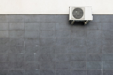 One air conditioner hangs on the wall of the store.