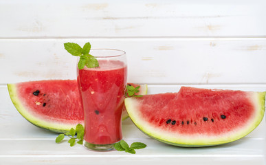 fresh  watermelon drink smoothie with mint on white table.