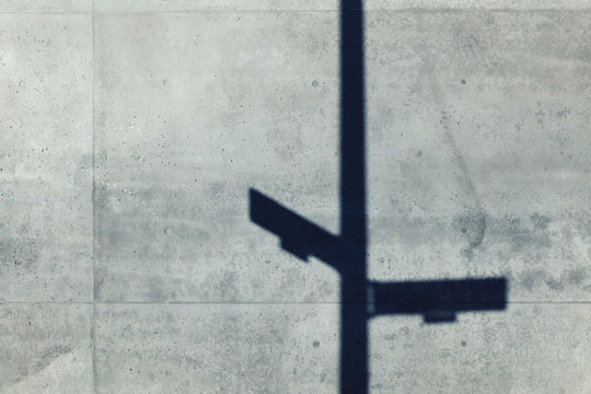 Low angle view of shadow on gray concrete wall