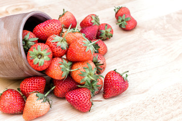Fresh strawberry in wooden on table.