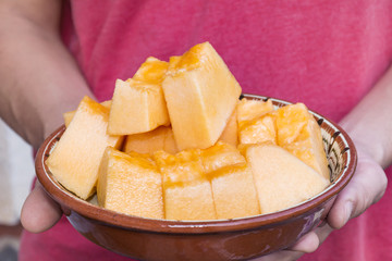 man eating melon