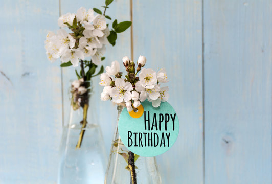 bouquet of spring cherry  flowers with happy birthday card