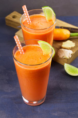 Carrot ginger smoothie, garnished with lime
