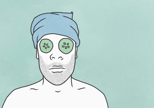 Man wearing face mask and towel against blue background
