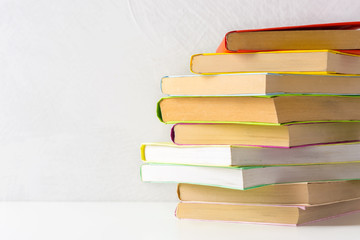  pile of paperback books on a table